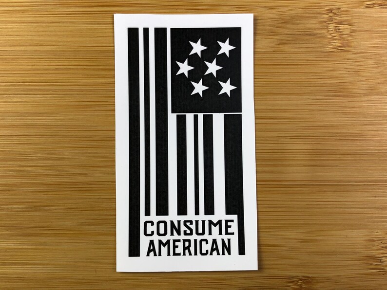 May include: Black and white sticker with a stylized American flag design and the text "CONSUME AMERICAN".