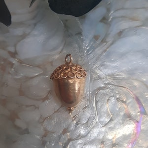 Vintage acorn charm. Gilt gold metal acorn