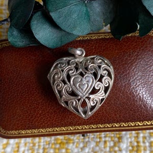 Vintage silver heart locket pierced filigree design