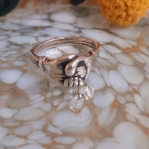 Clasped hands shop ring