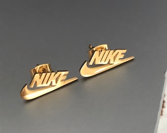 nike gold studs