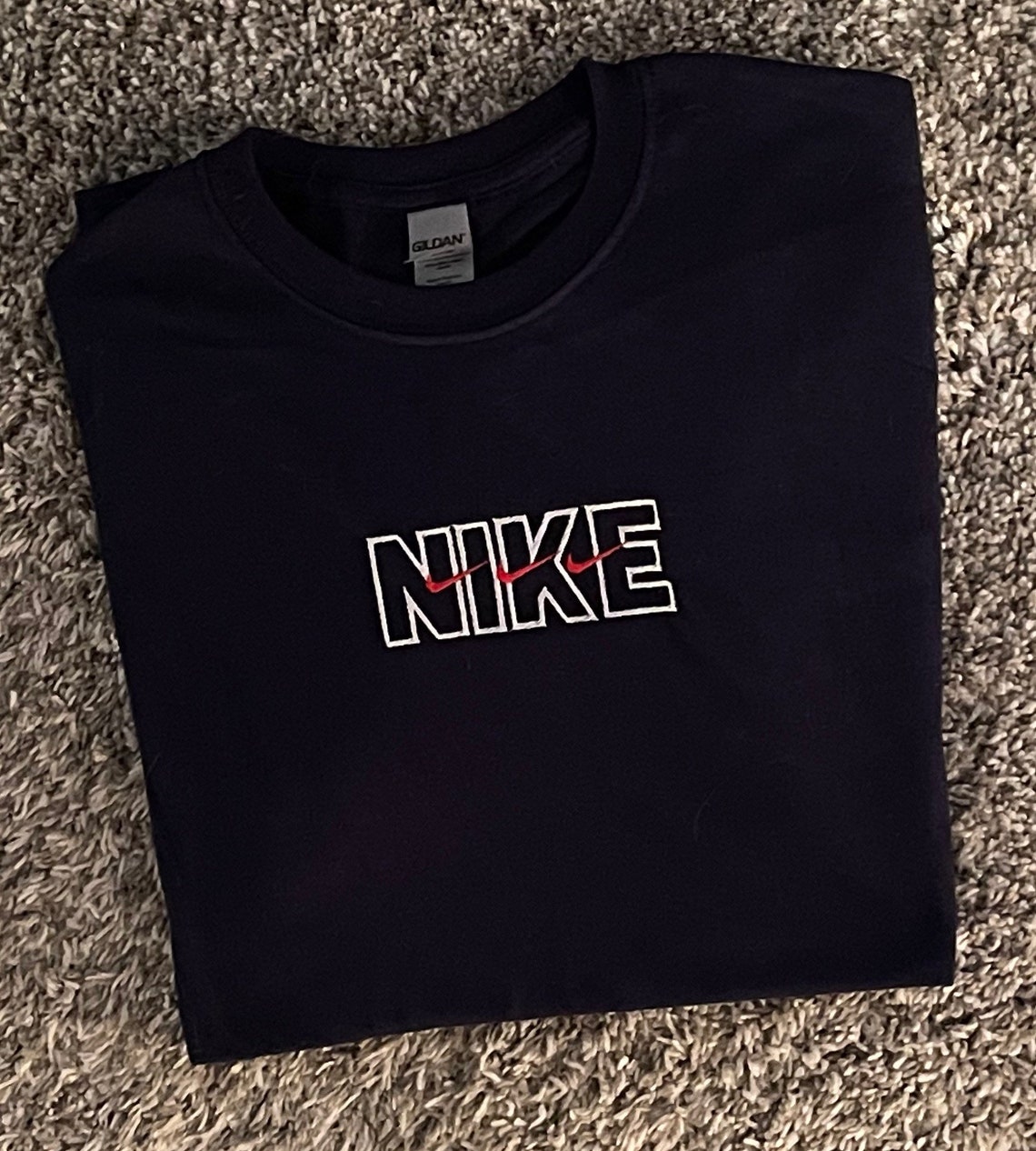 stacking checks nike shirt