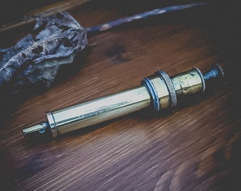 Unusual French antique brass syringe, in beautiful condition; over 100 years old medical paraphernalia. Very Gothic.