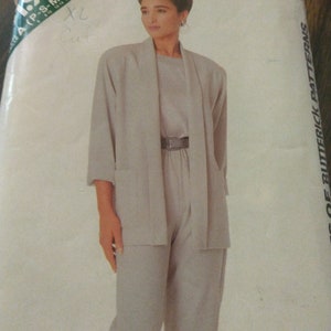 May include: A sewing pattern for a long-sleeved jacket and pants. The pattern is from See & Sew by Butterick and is number 598. The pattern is for sizes P-S-M-L-XL.