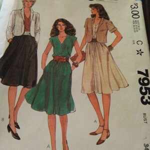 May include: A vintage McCall's sewing pattern for a dress and jacket. The pattern is for a bust size of 34 and includes three different styles. The pattern is from the 1980s and features a retro look.