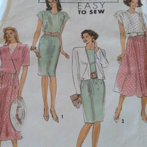May include: A sewing pattern for three different dresses. The dresses are all knee-length and have a simple, classic design. The pattern is from Simplicity and says "Easy to Sew".