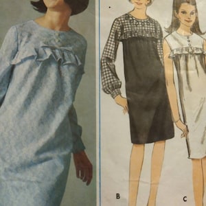 May include: A vintage sewing pattern for a dress with three different styles. The pattern is for a dress with a ruffled neckline and long sleeves. The pattern is for a teen and is proportioned for a teen.