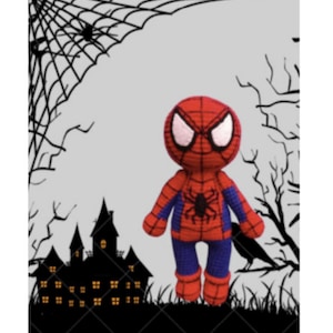 May include: A red and blue crocheted Spiderman toy with a black spider design on the chest. The toy is standing in front of a black silhouette of a haunted house and a spider web.