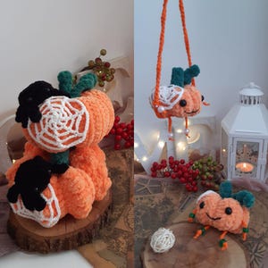 May include: Three crocheted orange pumpkins with black spider accents and white crocheted spiderwebs. One pumpkin is hanging from a string with white beads.