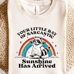 Your Little Ray of Sarcastic Sunshine Has Arrived Raccoon Shirt,Sarcastic Raccoon Shirts Trash Panda Shirt,Funny Raccoon Rainbow Hoodie