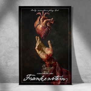 May include: A dark poster featuring a human heart above a hand, with the text "Only monsters play God" at the top. The word "Frankenstein" is written in cursive at the bottom, with "Guillermo del Toro" below it.