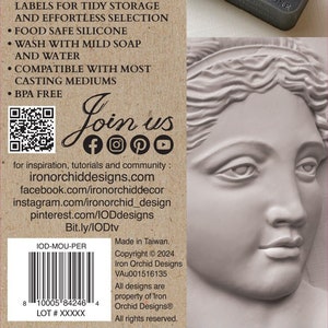 May include: A close-up of a brown and white label with the text "IOD MOULDSTM" and "IRON ORCHID DESIGNS". The label also includes a list of features and benefits of the product, such as "Micro-Rim", "Measure Marks", "Stack and Sort", and "Food Safe Silicone". The label also includes a QR code and social media icons.