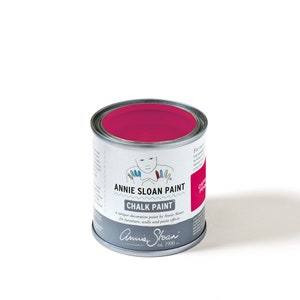 May include: A small can of Annie Sloan Chalk Paint in the color Capri Pink. The can is white with black text and a drawing of a child with colorful hands.
