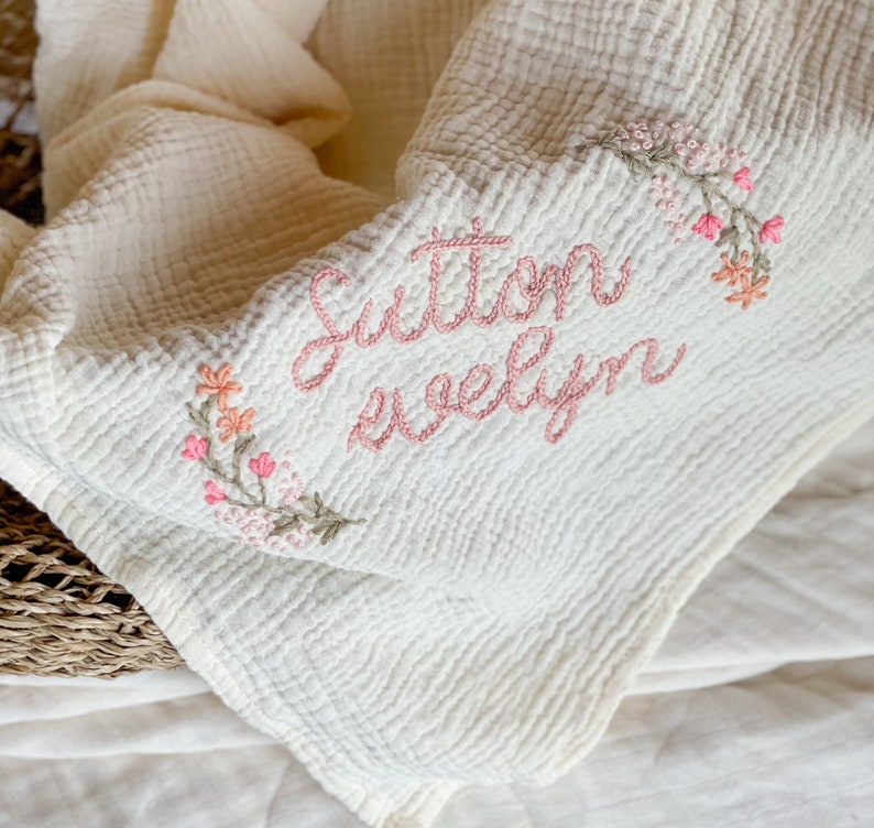 Personalized Hand Embroidered Baby Swaddle Blanket with Name and Floral Spray Cotton Muslin As "Sutton Evelyn"