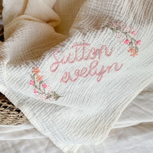 Personalized Hand Embroidered Baby Swaddle Blanket with Name and Floral Spray Cotton Muslin As "Sutton Evelyn"