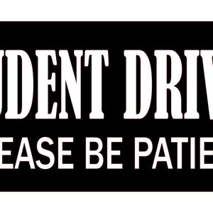 May include: Black and white sign with the text "STUDENT DRIVER PLEASE BE PATIENT".