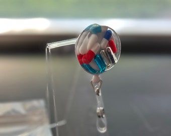 Blue and Red Chill Pill Badge Reel