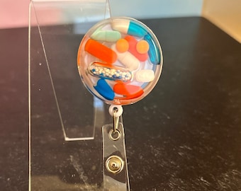 Orange and Blue Chill Pill Badge Reel