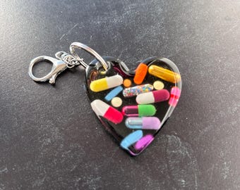 Heart Chill Pill Keychain - Black Background