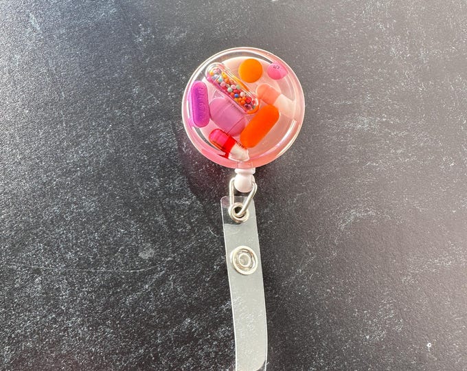 Purpled Orange Chill Pill Badge Reel