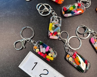 The Mystery Bin - Pill Keychain (silver single only)