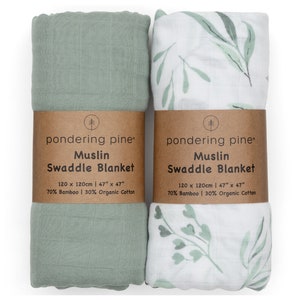 May include: Two green and white muslin swaddle blankets. One is solid green and the other has a leafy pattern. Both are made of 70% bamboo and 30% organic cotton. The blankets are 47 inches by 47 inches.