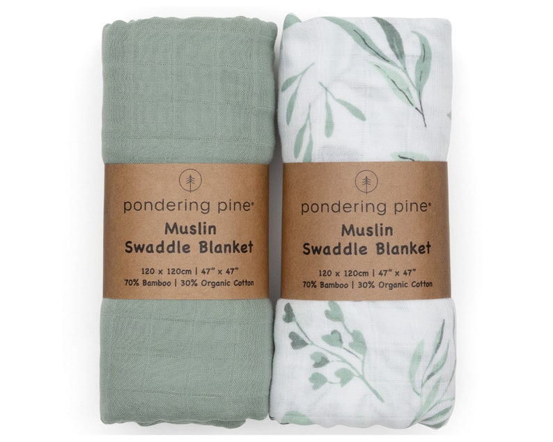 May include: Two green and white muslin swaddle blankets. One is solid green and the other has a leafy pattern. Both are made of 70% bamboo and 30% organic cotton. The blankets are 47 inches by 47 inches.