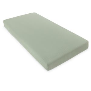 May include: A sage green fitted sheet. The sheet has a ribbed texture and is made of a soft, breathable fabric. The sheet is designed to fit a standard size mattress.