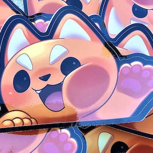 Puede incluir: Una colección de pegatinas naranjas y negras con un panda rojo de dibujos animados con una expresión feliz. Las pegatinas tienen un contorno negro y un diseño de huella de pata. El panda rojo está saludando con una sonrisa.