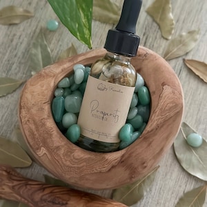Prosperity oil, abundance oil, intention setting oil, ritual oil, body oil, bath oil, spell oil, anointing oil