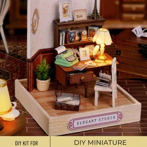 May include: DIY miniature office kit with a wooden desk, chair, typewriter, lamp, and books. The kit comes with instructions and all the necessary materials to build the model. The finished model is approximately 10 inches wide and 8 inches tall.