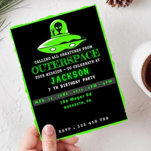 May include: A green and black birthday party invitation with a cartoon alien in a flying saucer. The invitation reads "Calling all creatures from Outer Space Your mission - to celebrate at Jackson 7th Birthday Party Mon. 12 June 2022. 2PM - 4PM 789 Meyer Rd Nazareth, PA RSVP 123 456 789"