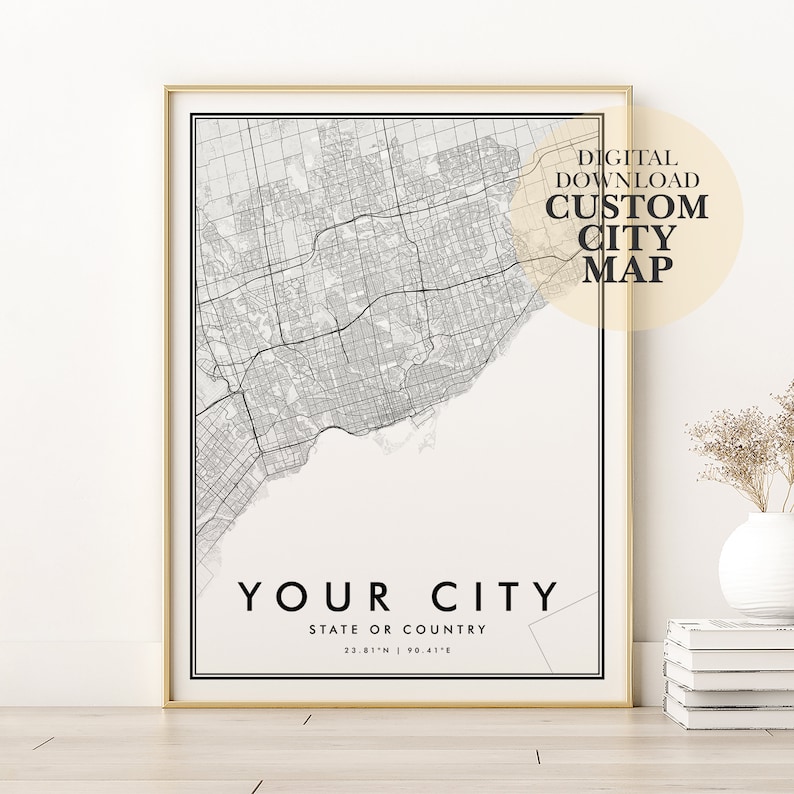 May include: A printable digital download of a custom city map. The map is black and white and shows the streets of a city. The text "YOUR CITY" is at the bottom of the map, along with the text "STATE OR COUNTRY" and coordinates. The text "DIGITAL DOWNLOAD CUSTOM CITY MAP" is in the upper right corner of the map.