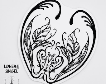 May include: Black and white line art sticker of two stylized wings forming a heart shape with a floral design in the center. The sticker has the text "Lonely Angel Tattoo Studio" at the bottom.