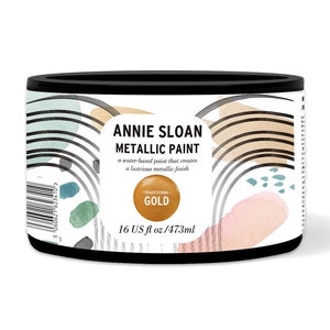 May include: A 16-ounce can of Annie Sloan Metallic Paint in Traditional Gold. The can is white with black lettering and a colorful abstract design.