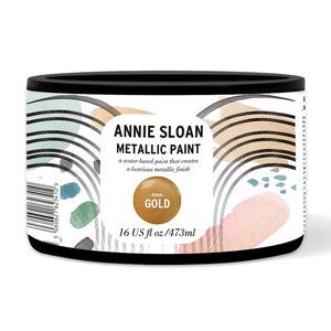 May include: A round metal can of Annie Sloan Metallic Paint in Rose Gold. The can is 16 fluid ounces or 473 milliliters. The can has a white label with black text and a gold circle with the words "Rose Gold" in black text.
