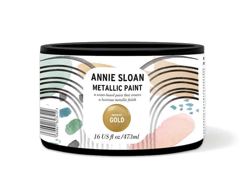 May include: A round metal can of Annie Sloan Metallic Paint in Modern Gold. The can is 16 fluid ounces or 473 milliliters.