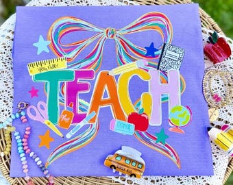 Teach with Multicolor Bow | Teacher T-Shirt | Teach | Graphic Tee | Trendy Shirt | Everyday Wear | Comfort Colors | Comfort Color Shirts