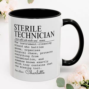May include: A white ceramic mug with a black interior and handle. The front features black text defining a Sterile Technician as an instrument-cleaning wizard who battles germs, organizes surgical chaos, protects from contamination, and finds missing tools. See Also: Charlotte.