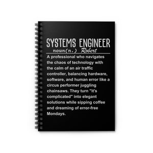May include: A black spiral notebook with a white definition of "Systems Engineer" with the name "Robert" included. The definition describes a systems engineer as a professional who navigates the chaos of technology with the calm of an air traffic controller.