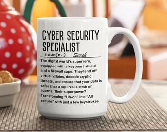 May include: White ceramic mug with a black design that reads "Cyber Security Specialist" and defines the term as "The digital world's superhero, equipped with a keyboard shield and a firewall cape. They fend off virtual villains, decode cryptic threats, and ensure that your data is safer than a squirrel's stash of acorns. Their superpower? Transforming "Uh-oh" into "All secure" with just a few keystrokes." The name "Sarah" is included in the definition.
