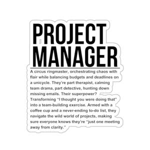 May include: A white sticker with the words "PROJECT MANAGER" in bold black letters. Below, a description of a project manager's skills and responsibilities is printed in black text.