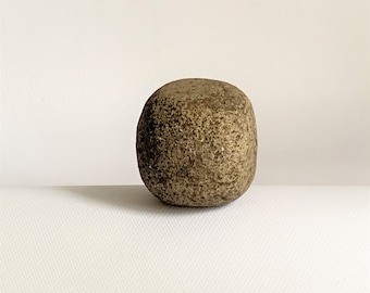 Ancient stone törochnik of the Neolithic era.A real neolithic stone.An nancient artifact.Prehistoric instrument. Rubbing stone. Time stone.