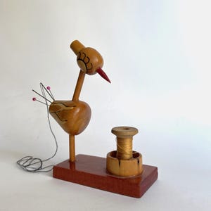 Vintage wooden pincushion from the USSR. Pincushion-crane. A place for storing threads, thimbles, needles. A device for needlework.