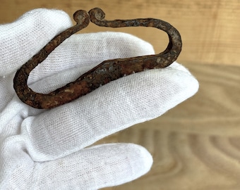 An ancient artifact for making fire. Viking lighter for fire 9th-12th centuries. Viking iron tools. Iron lighter.