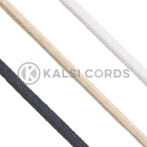 May include: Three different colours of cotton cord, black, white, and natural, are shown against a white background. The cords are all the same thickness and are lying parallel to each other.