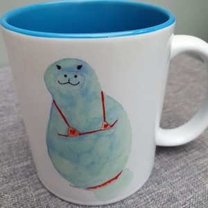 Manatee beach ready light blue mug