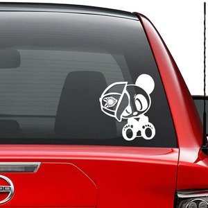 May include: White vinyl decal of a cartoon panda bear holding a half-eaten donut. The panda is wearing a hat and has a happy expression.