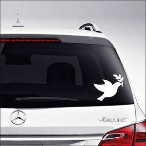 May include: White peace dove with an olive branch in its beak, car decal sticker.
