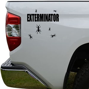 May include: White pickup truck with a black vinyl decal that says "Exterminator" with several black ant silhouettes around the text.